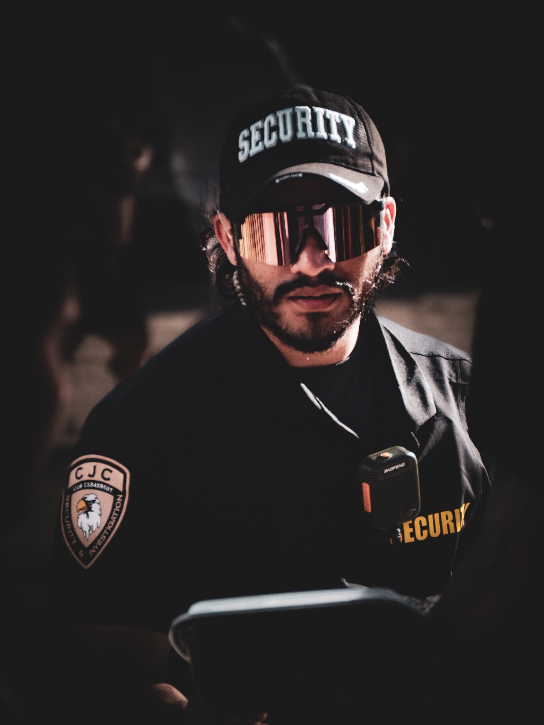 CJC Security officer monitoring post at night